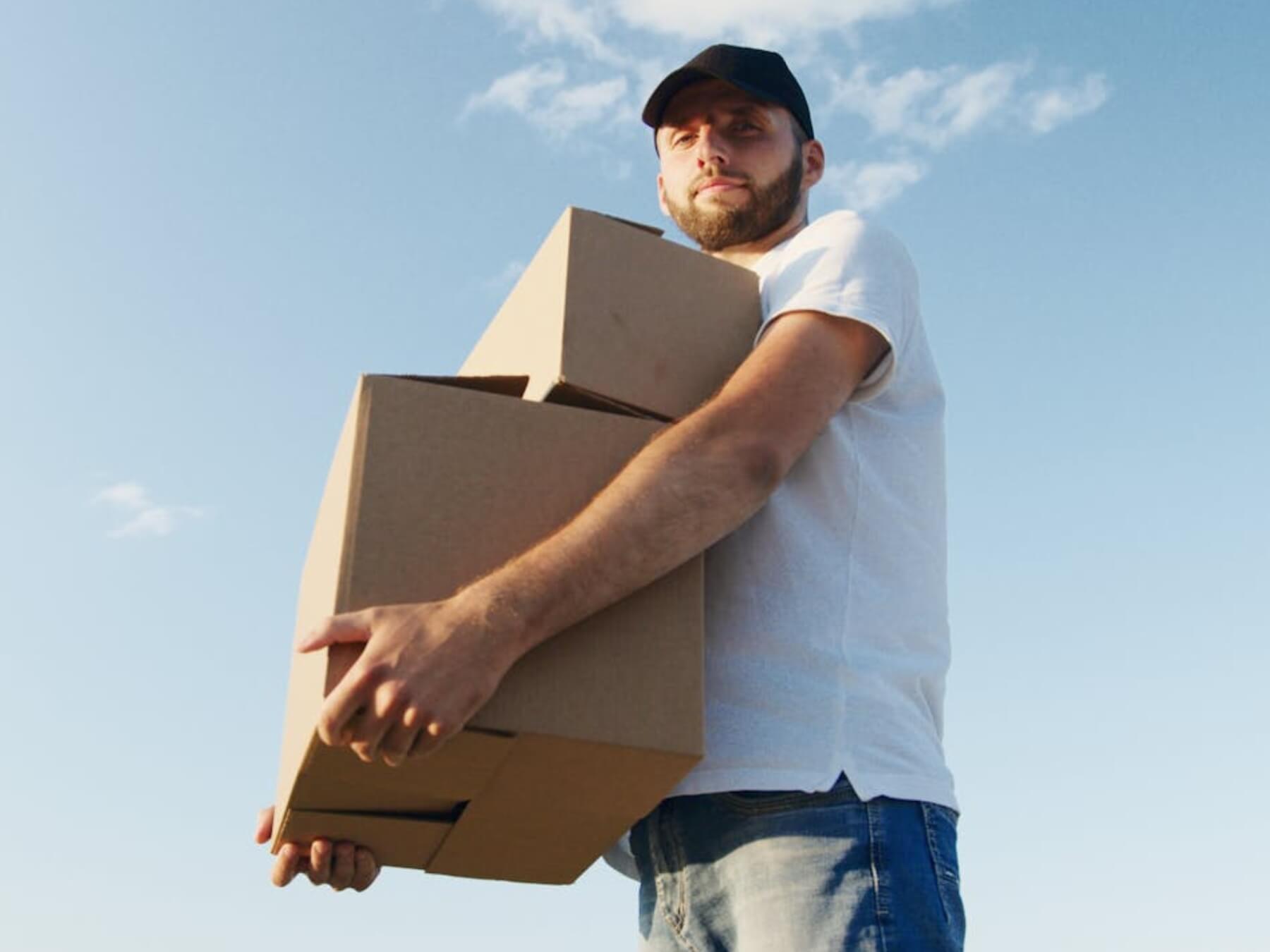 Man carrying moving boxes.