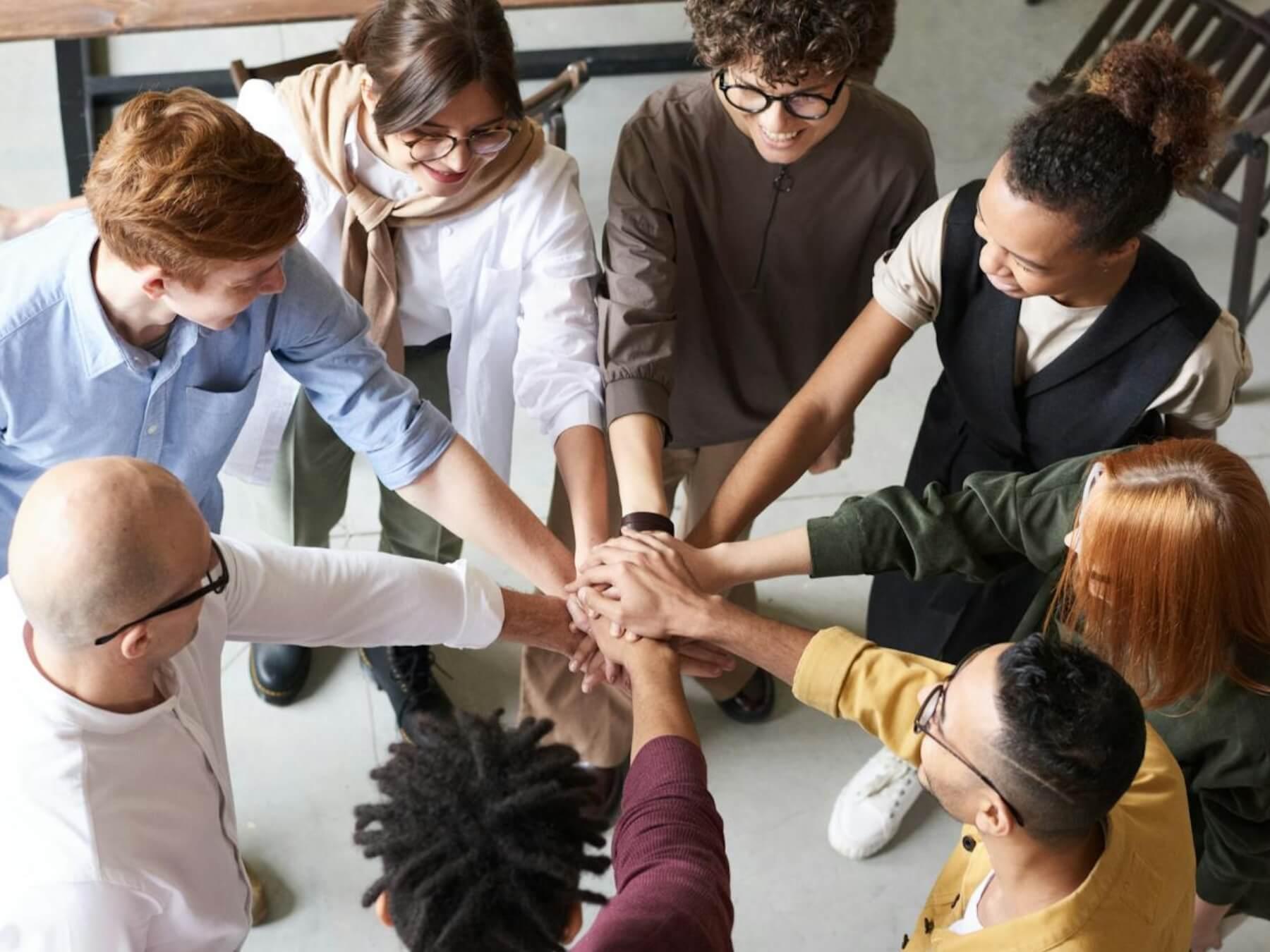 Photo Of People Holding Each Other's Hands.